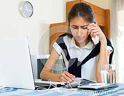 Teenager doing homework Stock Photo