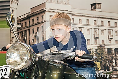 A teenager driving a motorcycle Stock Photo