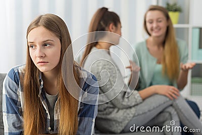 Teenager excluded from group Stock Photo