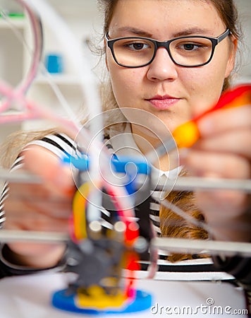 Teenager girl with 3d printe. education Stock Photo