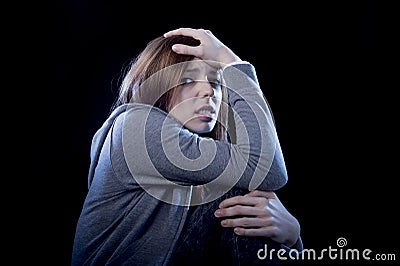 Teenager girl feeling lonely scared sad and desperate suffering Stock Photo