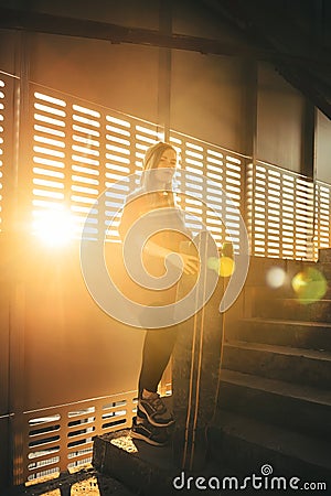 Teenager girl with long boards at abandoned parking Stock Photo