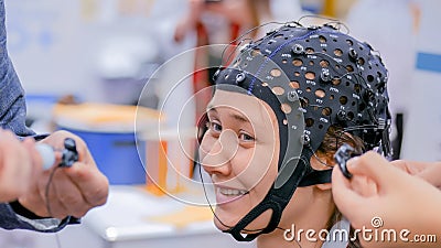 Teenager girl with medical eeg headset Editorial Stock Photo