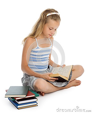 Teenager girl sit on floor and reading book Stock Photo