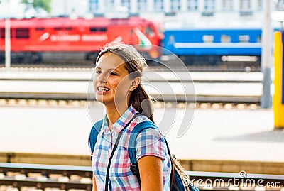 Teenager girl traveling alone at train station Stock Photo