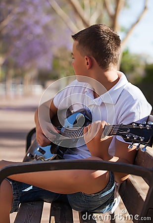 Teenager with a guitar Stock Photo