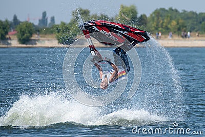 Teenager on Jet Ski-Water Sports in the summer having fun on the beach Editorial Stock Photo