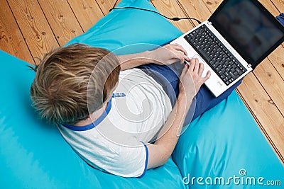 Teenager with laptop Stock Photo