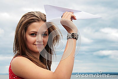 Teenager and paper plane Stock Photo