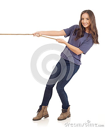 Teenager pulling a rope Stock Photo