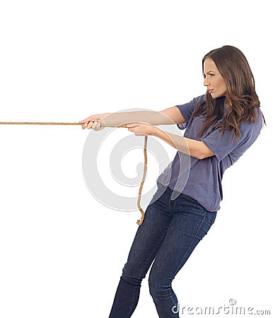 Teenager pulling a rope Stock Photo