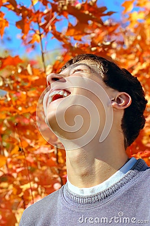 Teenager rejoices autumns Stock Photo