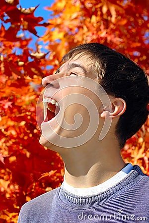 Teenager rejoices autumns Stock Photo
