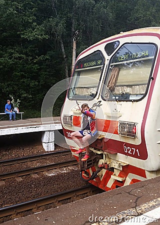 A teenager rides a train. Editorial Stock Photo