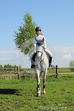Teenager riding horse Stock Photo