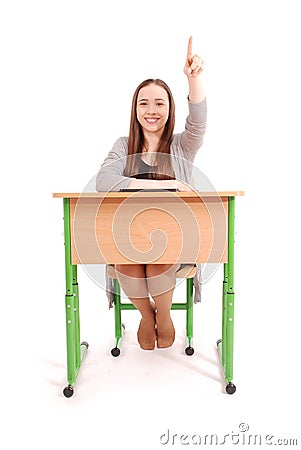Teenager school girl raising hand to ask question Stock Photo