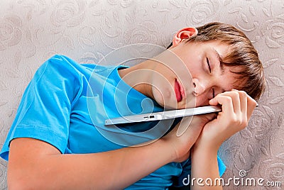 Teenager sleep with a Tablet Stock Photo