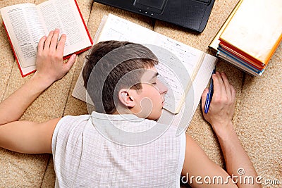 Teenager sleeps on the Books Stock Photo