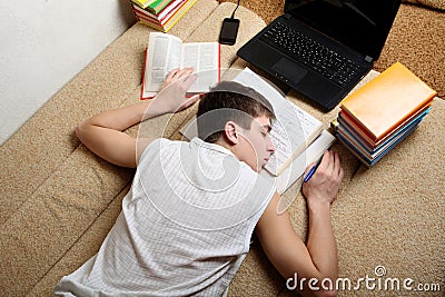 Teenager sleeps after Learning Stock Photo