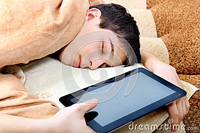 Teenager sleeps with Tablet Computer Stock Photo