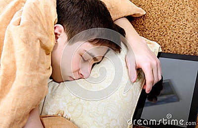 Teenager sleeps with Tablet Stock Photo