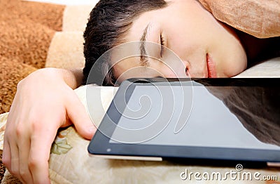 Teenager sleeps with Tablet Stock Photo