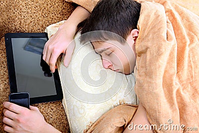 Teenager sleeps with Tablet Stock Photo