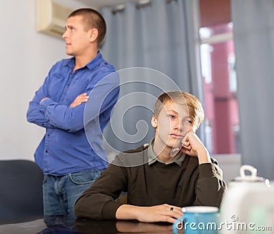 Teenager son quarreled with his upset father Stock Photo