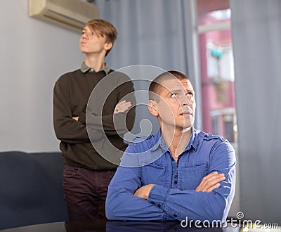 Teenager son quarreled with his upset father Stock Photo