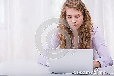 Teenager stalking classmate on internet Stock Photo