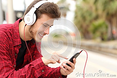 Teenager student learning with online course in a smart phone Stock Photo