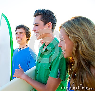 Teenager surfers group happy in beach shore Stock Photo