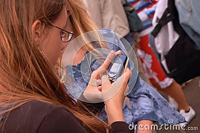 Teenager texting outdoors Stock Photo