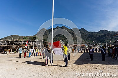Teenager train for Indonesia independent day in the small island with mountain at the background Editorial Stock Photo