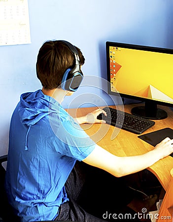 Teenager using computer Editorial Stock Photo