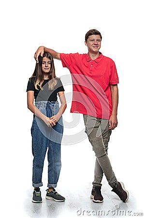 Teenagers, boy and girl, sort things out in a joking manner Stock Photo