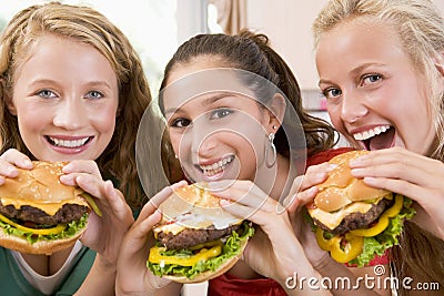 Teenagers Eating Burgers Stock Photo