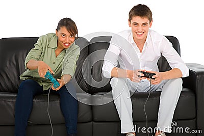 Teenagers playing with playstation Stock Photo