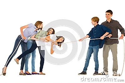 Teenagers playing tug of wa Stock Photo