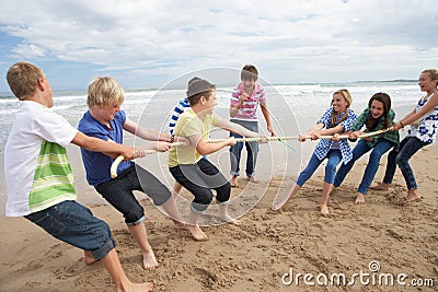 Teenagers playing tug of war Stock Photo