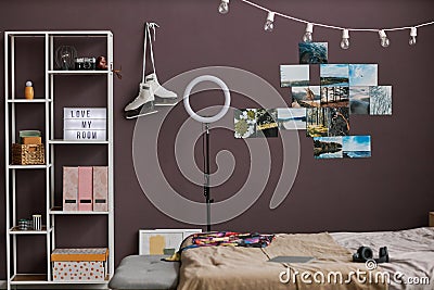 Teenagers room interior with hobbie items on maroon wall Stock Photo