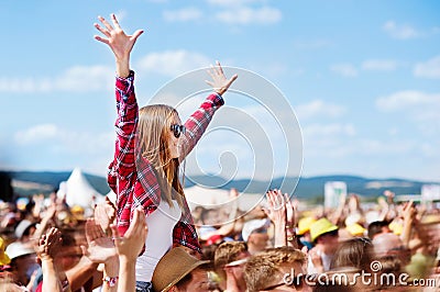 Teenagers at summer music festival enjoying themselves Stock Photo