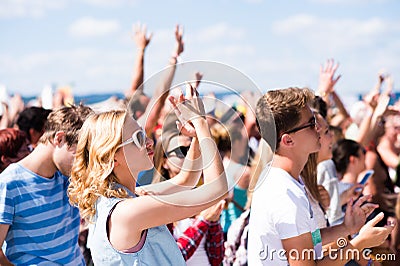 Teenagers at summer music festival having good time Stock Photo