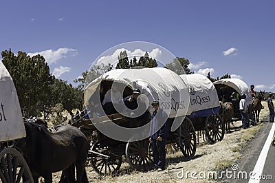 Teenagers traveling on covered wagons Editorial Stock Photo