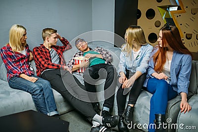 Teenagers waiting for showtime in cinema hall Stock Photo