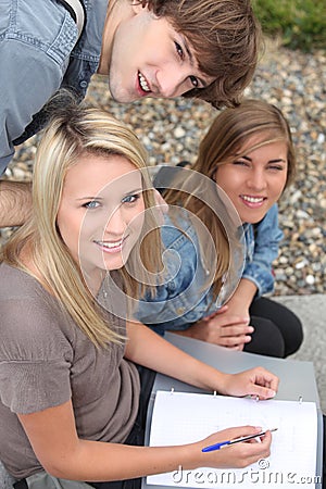 Teenagers working outside Stock Photo