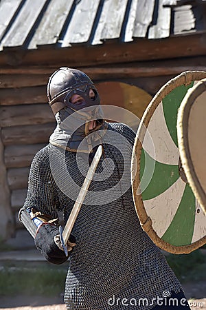 Teens fighting with swords in medieval dress Editorial Stock Photo