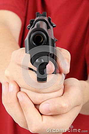 Teens hand with gun, gangster Stock Photo