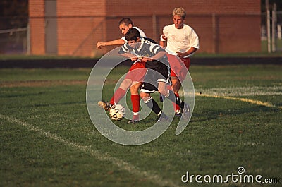 Teens playing a high school soccer game Editorial Stock Photo