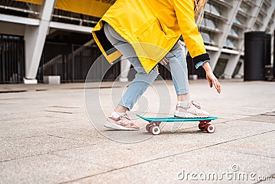 Teens ride a skateboard in the city. Youth culture Stock Photo